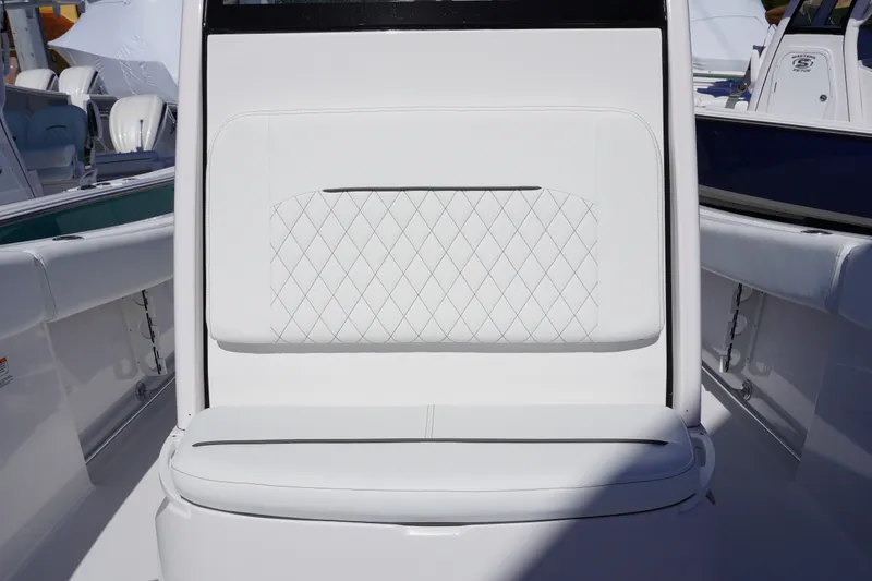 Slide: The Image of 2026 Sportsman Open 232 Center Console boat with white cushioned seating. - 23