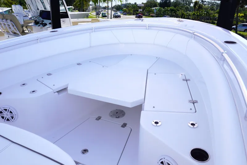 Slide: The Image of 2026 Sportsman Open 232 Center Console boat interior with seating and storage compartments. - 17
