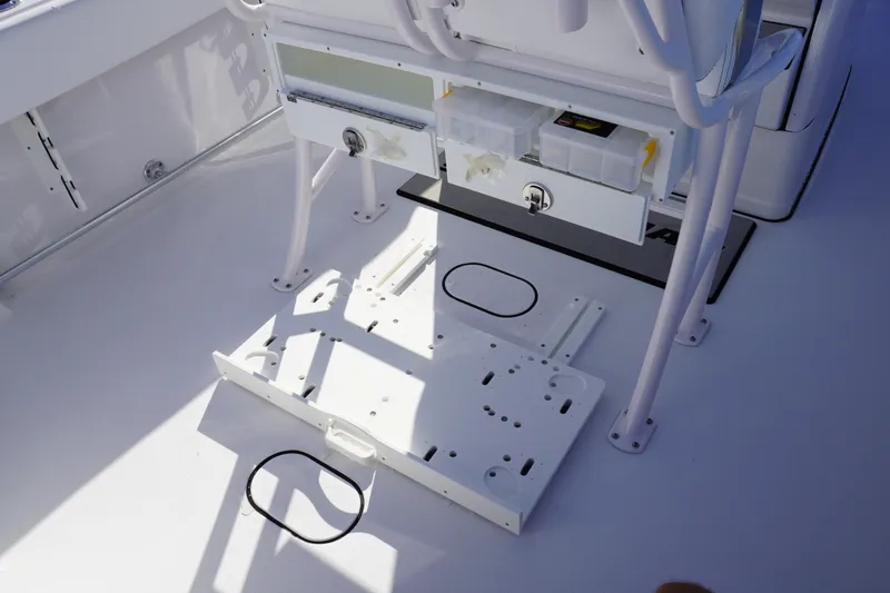 Slide: The Image of 2026 Sportsman Open 232 Center Console boat interior with storage compartments. - 7