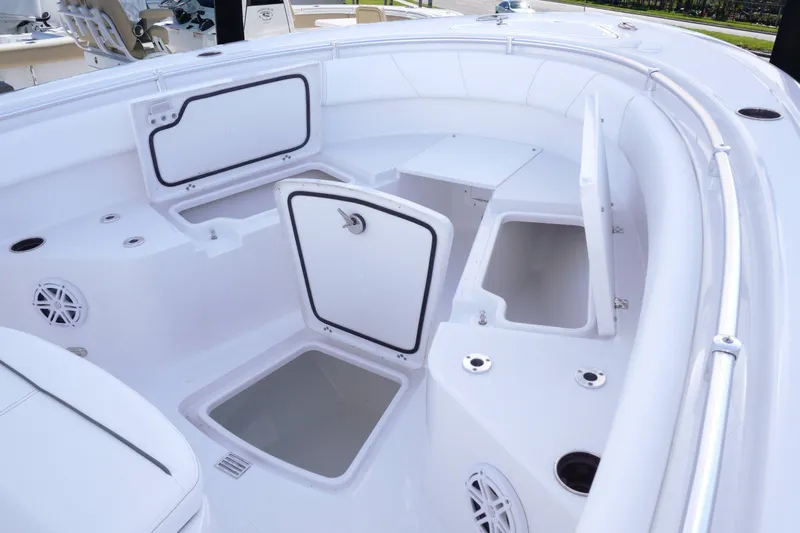 Slide: The Image of 2026 Sportsman Open 232 Center Console boat interior with open storage compartments. - 16