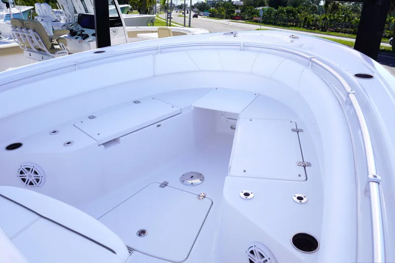 Slide: The Image of 2026 Sportsman Open 232 Center Console boat interior with storage compartments and seating. - 15