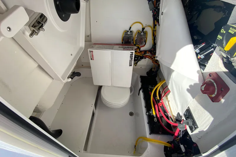 Slide: The Image of 2026 Sportsman Heritage 231 Center Console interior with wiring and equipment. - 16