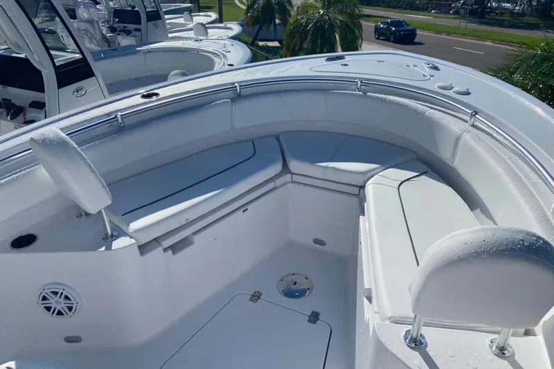 Slide: The Image of 2026 Sportsman Heritage 231 Center Console boat interior with cushioned seating and sleek design. - 14