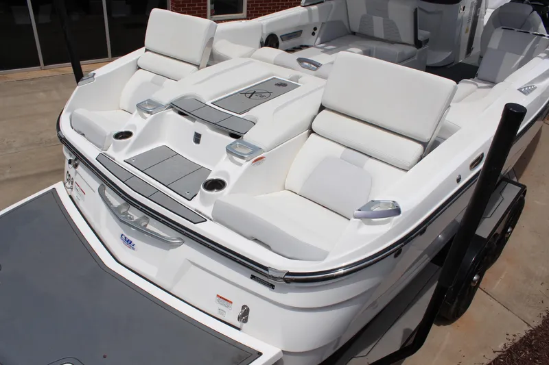 Slide: The Image of 2019 MasterCraft X26 boat with luxurious seating and sleek design. - 7