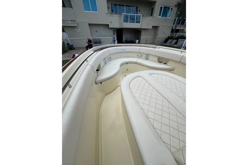Slide: The Image of 2023 Chris-Craft Catalina 30 boat interior with luxurious cream seating. - 11