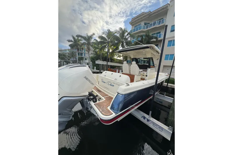 Slide: The Image of 2023 Chris-Craft Catalina 30 docked, featuring Mercury engines and luxurious seating. - 18