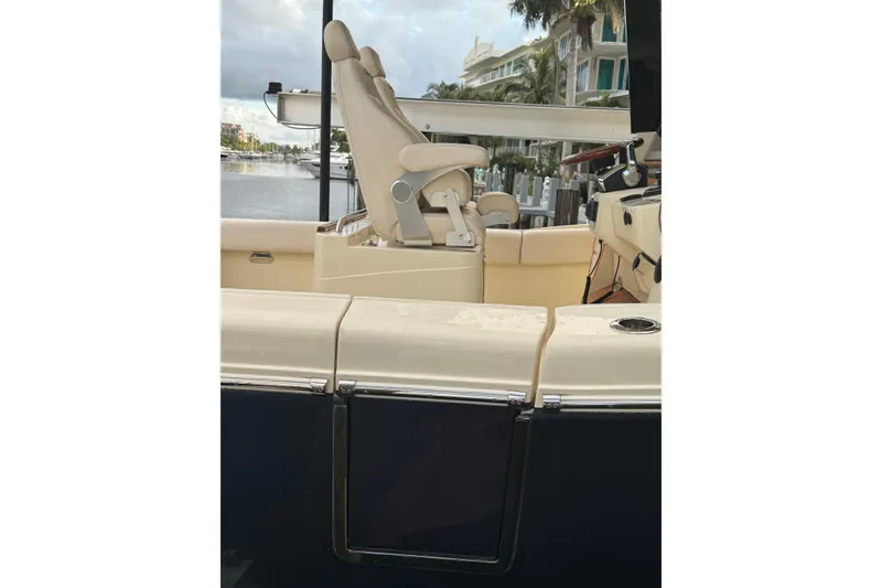 Slide: The Image of 2023 Chris-Craft Catalina 30 boat interior with luxurious seating and waterfront view. - 19