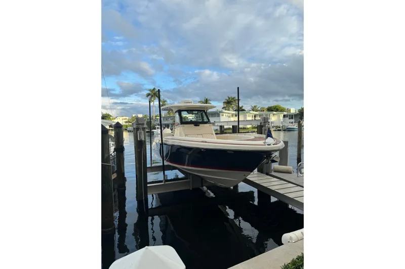 Slide: The Image of 2023 Chris-Craft Catalina 30 docked at marina under cloudy sky. - 20