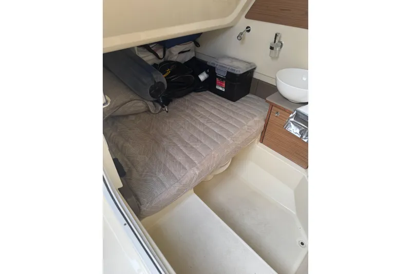 Slide: The Image of Interior cabin of 2023 Chris-Craft Catalina 30 with bed and storage. - 23