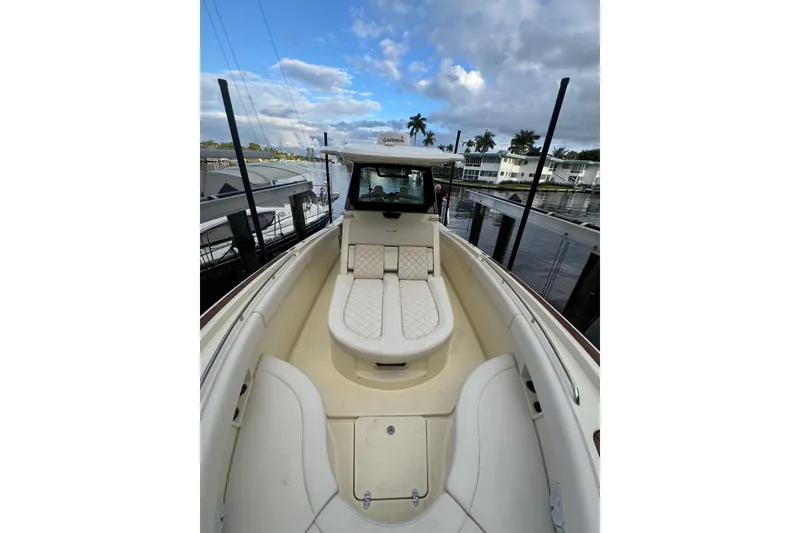 Slide: The Image of 2023 Chris-Craft Catalina 30 boat interior with luxurious seating and waterfront view. - 8