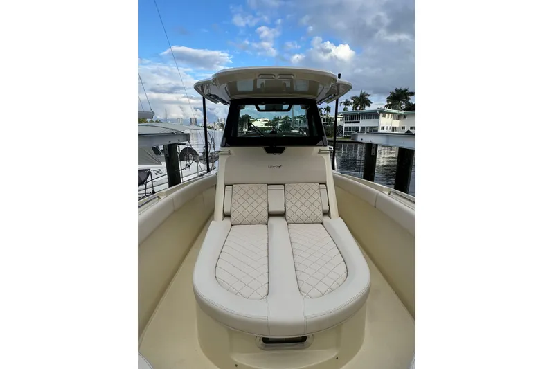 Slide: The Image of 2023 Chris-Craft Catalina 30 boat with luxurious seating and elegant design. - 9