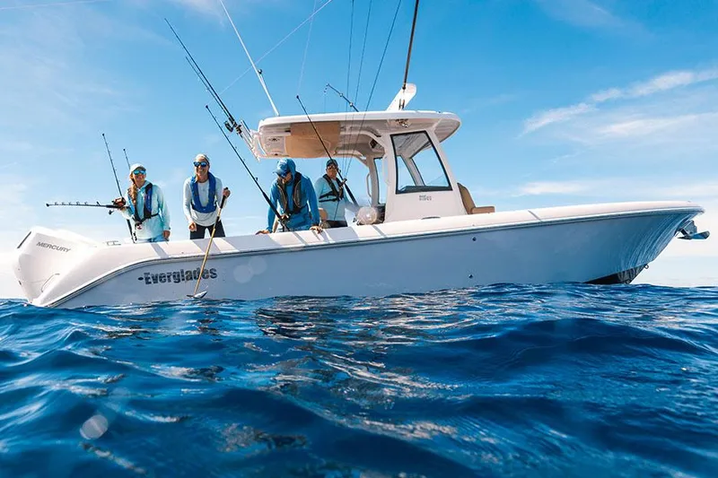 The Image of Manufacturer Provided Image: 2025 Everglades 315 Center Console boat with anglers fishing in open sea. - 0