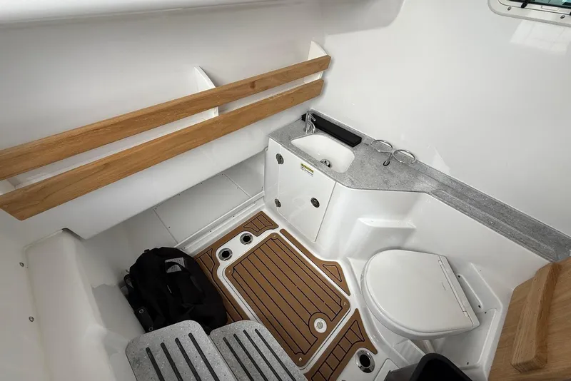 Slide: The Image of Interior of 2026 Everglades 315 Center Console boat with sink and toilet. - 18