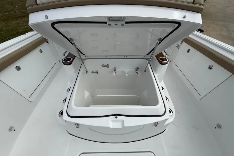Slide: The Image of Open storage compartment on 2026 Everglades 315 Center Console boat, showcasing spacious interior. - 21