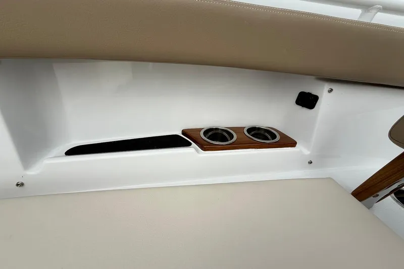 Slide: The Image of Interior detail of 2026 Everglades 315 Center Console boat with cup holders. - 24