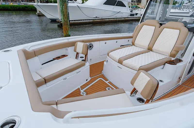 Slide: The Image of Manufacturer Provided Image: 2025 Everglades 315 Center Console boat with luxurious seating and teak flooring. - 6