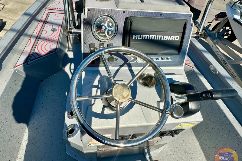 Slide: The Image of 2024 SeaArk SW20B BAY boat dashboard with steering wheel and Humminbird system. - 15