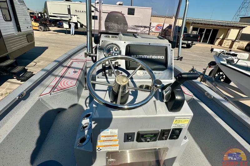 Slide: The Image of 2024 SeaArk SW20B BAY boat dashboard with steering wheel and Humminbird electronics. - 16