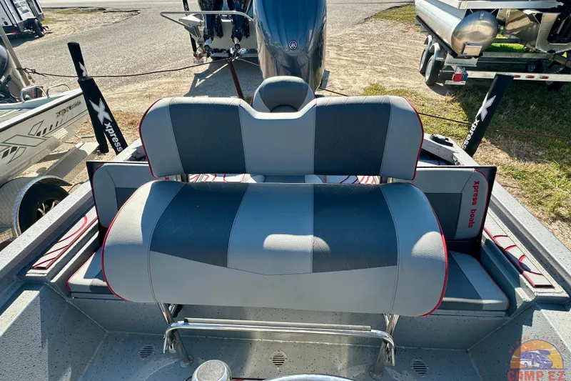 Slide: The Image of 2024 SeaArk SW20B BAY boat interior with gray and red seating, featuring Xpress Boats branding. - 18