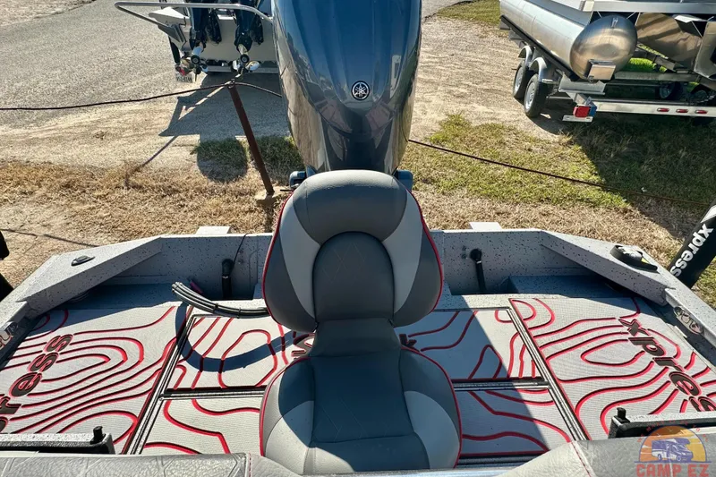 Slide: The Image of 2024 SeaArk SW20B BAY boat interior with patterned flooring and cushioned seat. - 22