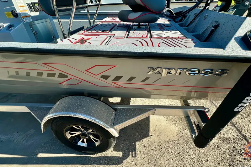 Slide: The Image of 2024 SeaArk SW20B BAY boat on trailer, featuring sleek design and comfortable seating. - 9