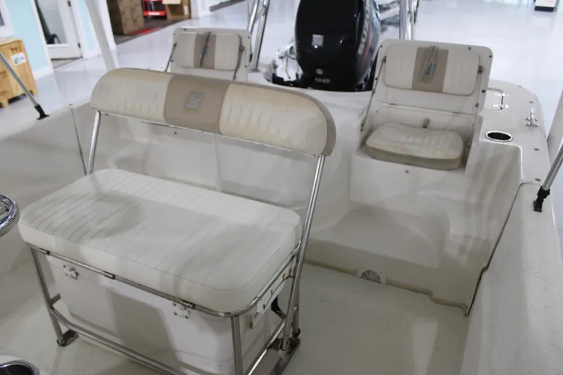Slide: The Image of 2014 Carolina Skiff 198 DLV boat interior with seating and motor. - 12