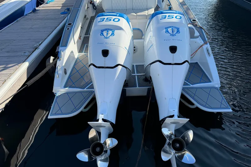 Slide: The Image of 2016 Statement 350 Open boat with twin 350 horsepower outboard engines docked at marina. - 10