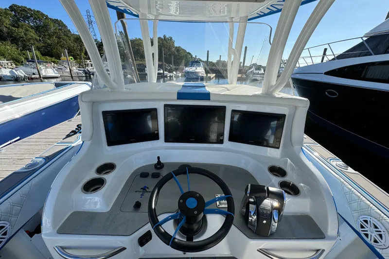 Slide: The Image of Cockpit of 2016 Statement 350 Open boat with modern navigation displays and controls. - 6