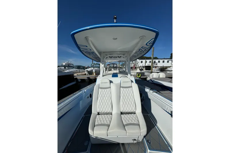 Slide: The Image of 2016 Statement 350 Open boat with luxurious seating at a marina. - 8