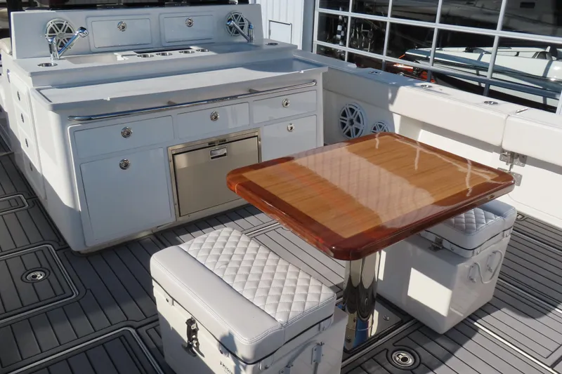 Slide: The Image of Luxurious 2018 HCB 53 yacht interior with elegant seating and polished wooden table. - 11