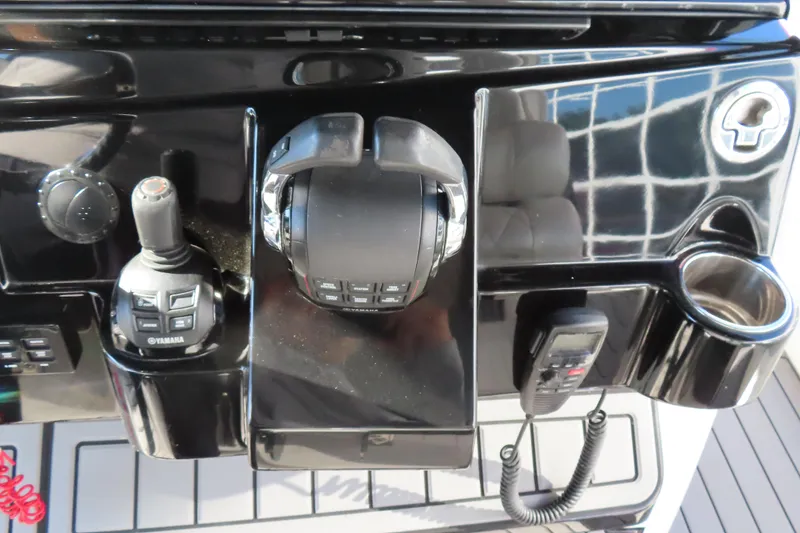 Slide: The Image of Control panel of a 2018 HCB 53 boat with Yamaha joystick and throttle. - 29