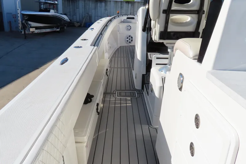 Slide: The Image of 2018 HCB 53 boat interior with sleek deck and seating area. - 32