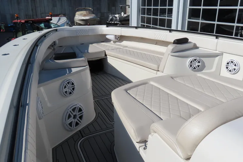 Slide: The Image of Luxurious 2018 HCB 53 boat interior with plush seating and modern audio system. - 35