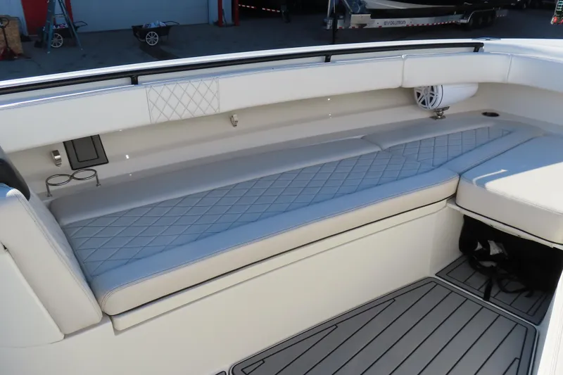 Slide: The Image of 2018 HCB 53 boat interior with cushioned seating and speaker system. - 37