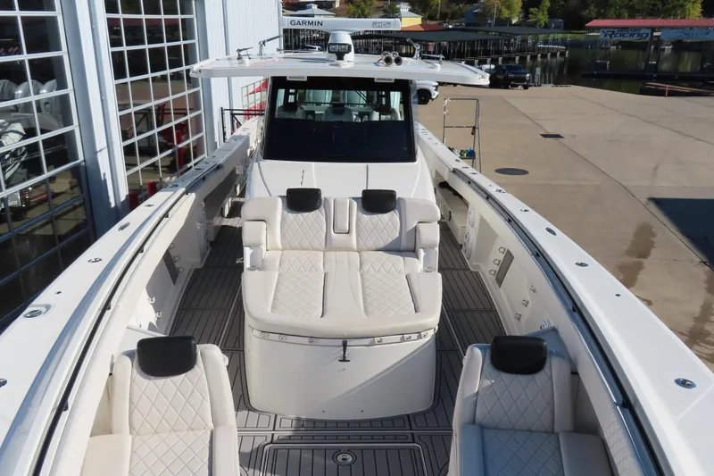 Slide: The Image of 2018 HCB 53 boat with luxurious seating and advanced navigation equipment. - 39