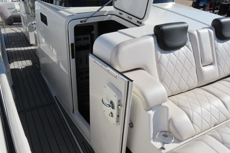 Slide: The Image of Luxurious 2018 HCB 53 yacht interior with plush seating and open storage compartment. - 51