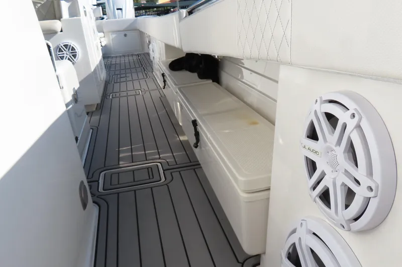 Slide: The Image of Interior view of 2018 HCB 53 boat with sleek flooring and JL Audio speakers. - 53