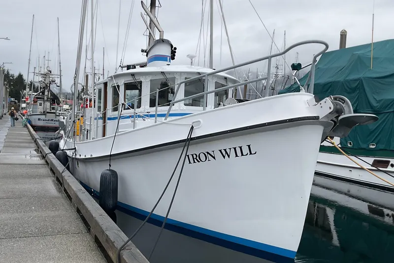 The Image of Custom 2006 Sprague boat "Iron Will" docked at a marina on a cloudy day. - 0