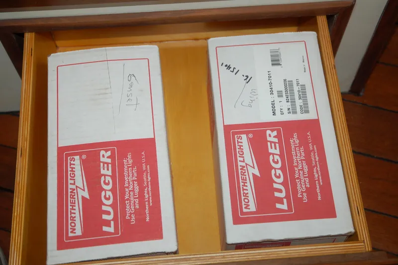 Slide: The Image of Boxes labeled "Northern Lights Lugger" in a wooden drawer, Custom Sprague 2006 model. - 100