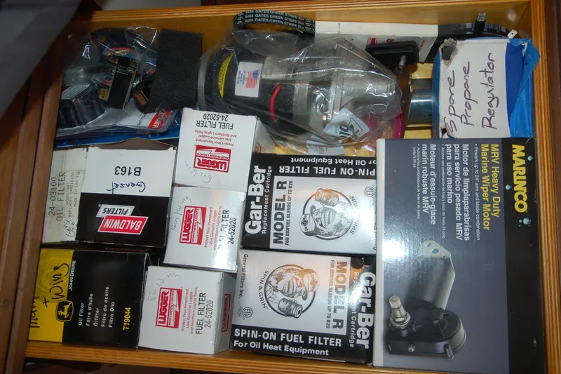 Slide: The Image of Drawer with assorted automotive parts, including filters and a marine wiper motor, Custom Sprague 2006. - 101