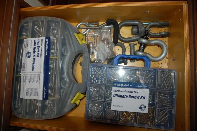Slide: The Image of Drawer with West Marine screw kits and metal shackles, Custom Sprague 2006. - 103