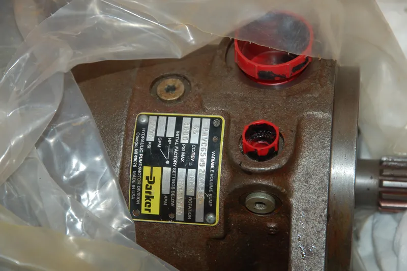Slide: The Image of Close-up of a 2006 Custom Sprague hydraulic pump with visible label and red caps. - 108