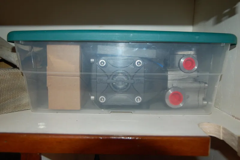 Slide: The Image of Plastic container with Custom Sprague 2006 mechanical parts, stored on a shelf. - 110