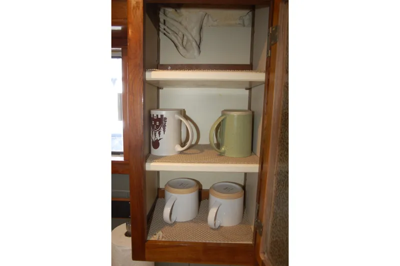 Slide: The Image of Wooden cabinet with mugs and cups on shelves, Custom Sprague model, 2006. - 117