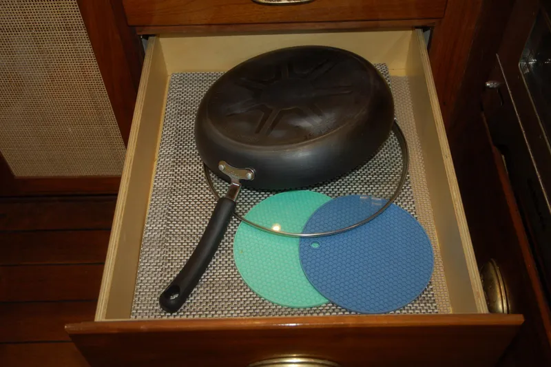 Slide: The Image of Drawer with a black pan, lid, and colorful silicone mats, Custom Sprague 2006 model. - 124