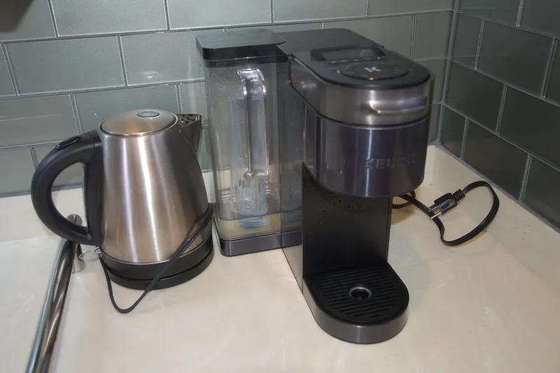 Slide: The Image of Electric kettle and coffee maker on a kitchen counter, Custom Sprague model, 2006. - 128