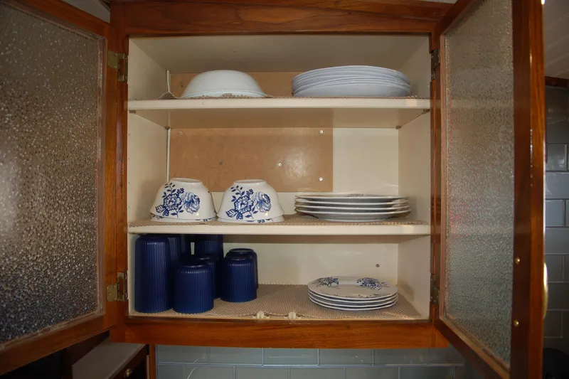 Slide: The Image of Open kitchen cabinet with blue and white dishes, Custom Sprague model, 2006. - 129
