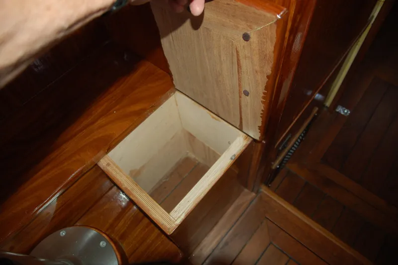 Slide: The Image of Wooden compartment with open lid in a 2006 Custom Sprague interior. - 134