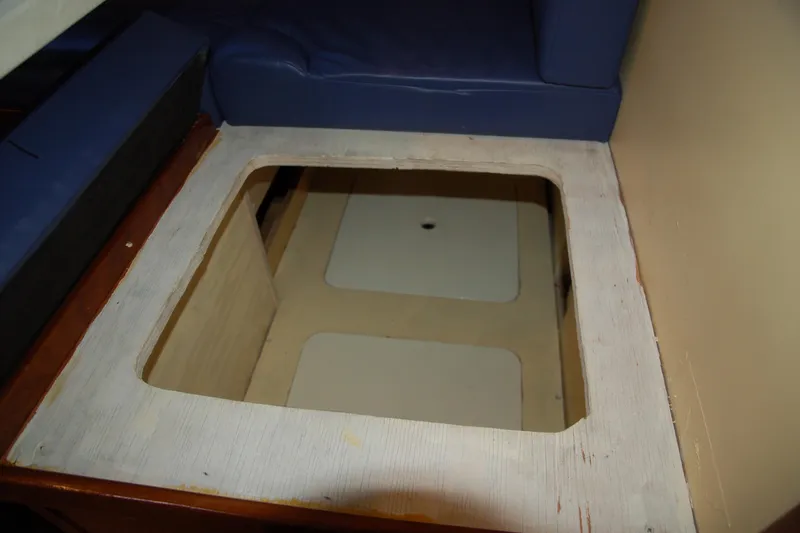 Slide: The Image of Custom 2006 Sprague interior with open storage compartment under blue seating. - 135