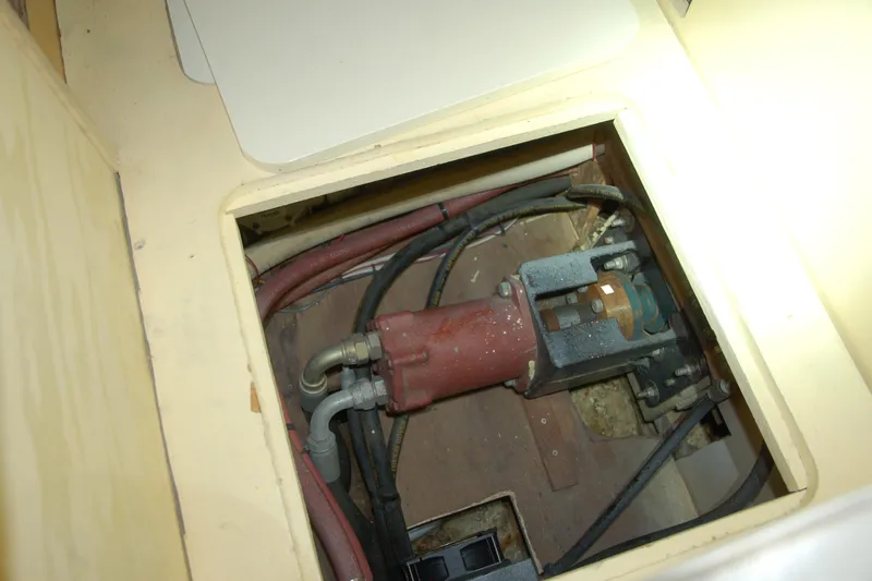 Slide: The Image of Custom 2006 Sprague mechanical component with hoses and fittings in a compartment. - 136